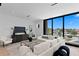 Open concept living room with a modern couch, a large window, and a modern decor at 98 W Davis Blvd, Tampa, FL 33606