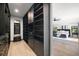 Spacious walk-in closet boasting dark wood shelving and drawers across from a framed mirror at 98 W Davis Blvd, Tampa, FL 33606