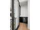 A modern-designed wine bar featuring a dark-colored wine refrigerator and marble countertop at 98 W Davis Blvd, Tampa, FL 33606