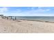 Beach view with blue beach chairs and ocean view at 1019 Goshen Rd, Tarpon Springs, FL 34689