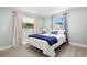Comfortable bedroom featuring stylish bedding, wood-look flooring, and plenty of natural light at 1019 Goshen Rd, Tarpon Springs, FL 34689