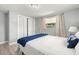 Cozy bedroom featuring plush bedding, ample closet space, and a bright window at 1019 Goshen Rd, Tarpon Springs, FL 34689