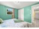 Cozy bedroom with bright walls, closet, and view from window at 1019 Goshen Rd, Tarpon Springs, FL 34689