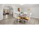 Bright dining room with a round table and seating for four, adjacent to the kitchen at 1019 Goshen Rd, Tarpon Springs, FL 34689