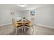 Dining area features seating for four, natural light, and neutral paint and flooring at 1019 Goshen Rd, Tarpon Springs, FL 34689
