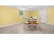 Inviting dining area with seating for four and view to the outside at 1019 Goshen Rd, Tarpon Springs, FL 34689