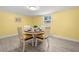 Dining room features round table with seating for four and ample natural light at 1019 Goshen Rd, Tarpon Springs, FL 34689