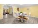 View of dining area with an open floor plan with view to kitchen and living space at 1019 Goshen Rd, Tarpon Springs, FL 34689