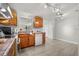 Bright kitchen showcasing wood cabinets, modern appliances, and ample counter space with view to door at 1019 Goshen Rd, Tarpon Springs, FL 34689