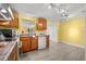Bright kitchen featuring wood-look floors, white appliances, and ample counter space at 1019 Goshen Rd, Tarpon Springs, FL 34689