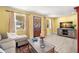 Bright living room with stylish furniture, wood-look floors, and large windows at 1019 Goshen Rd, Tarpon Springs, FL 34689