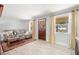 Comfortable living area boasts wood-look flooring, natural light, and modern furnishings at 1019 Goshen Rd, Tarpon Springs, FL 34689