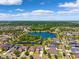 An aerial view of homes nestled around a serene lake, showcasing the community's picturesque setting at 11907 Streambed Dr, Riverview, FL 33579
