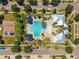 Overhead aerial view shows a community pool and recreation area with a playground at 11907 Streambed Dr, Riverview, FL 33579