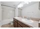 Bathroom featuring double sinks, large mirror, and shower with tub at 11907 Streambed Dr, Riverview, FL 33579