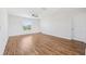 Large, bright bedroom with hardwood floors, ceiling fan, and a window at 11907 Streambed Dr, Riverview, FL 33579