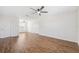 Large, bright bedroom with hardwood floors, ceiling fan, and two closets with doors at 11907 Streambed Dr, Riverview, FL 33579
