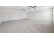 Expansive bonus room features wall to wall carpeting and ceiling fans at 11907 Streambed Dr, Riverview, FL 33579