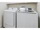 Laundry room with a newer model washer and dryer at 11907 Streambed Dr, Riverview, FL 33579