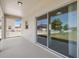 Covered patio with tile and a sliding glass door for indoor outdoor living at 11907 Streambed Dr, Riverview, FL 33579