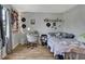 Bright bedroom features wood floors, whimsical decor, and soft natural light at 12155 Environmental Dr # 3, New Port Richey, FL 34654
