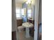 Bathroom ready for renovation with window, vanity and toilet at 125 80Th N Ave, St Petersburg, FL 33702