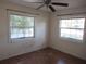 Bedroom with ceiling fan and window, showing water damage at 125 80Th N Ave, St Petersburg, FL 33702