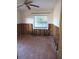 Bedroom shows window, fan, and unfinished walls at 125 80Th N Ave, St Petersburg, FL 33702