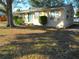 Charming one-story home with a well-maintained front yard and a pop of color from the blue front door at 125 80Th N Ave, St Petersburg, FL 33702