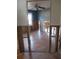 Open-concept living room featuring ceiling fan, natural light, and wood-look flooring under renovation at 125 80Th N Ave, St Petersburg, FL 33702