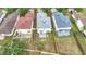 Aerial view of homes with fenced yards in a well-maintained neighborhood with mature trees and lush landscaping at 12508 Evington Point Dr, Riverview, FL 33579