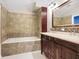 Bathroom with double vanity, a bathtub, and updated fixtures at 12508 Evington Point Dr, Riverview, FL 33579