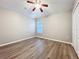 Bedroom with laminate floors, ceiling fan, and double door closet offering a comfortable retreat at 12508 Evington Point Dr, Riverview, FL 33579