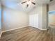 Bedroom with sloped ceiling, laminate floors, and double door closet providing ample space at 12508 Evington Point Dr, Riverview, FL 33579