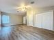 Large bedroom boasting vaulted ceiling, laminate floors, and double closets for ample storage at 12508 Evington Point Dr, Riverview, FL 33579