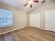 Cozy bedroom with vaulted ceiling, laminate floors, and closet offering comfortable living space at 12508 Evington Point Dr, Riverview, FL 33579