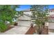 Charming two-story home with a two-car garage and well-maintained front yard at 12508 Evington Point Dr, Riverview, FL 33579