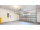 Spacious two car garage is clean, painted, and houses an automatic garage door opener at 12508 Evington Point Dr, Riverview, FL 33579