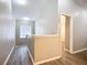 Upstairs hallway featuring wood-look flooring, and neutral paint at 12508 Evington Point Dr, Riverview, FL 33579
