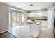 Contemporary kitchen with stainless steel appliances, an island, and a sliding glass door to the backyard at 12508 Evington Point Dr, Riverview, FL 33579