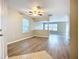 Open-concept living area with wood-look flooring and neutral paint throughout at 12508 Evington Point Dr, Riverview, FL 33579