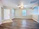 Bright living room with wood-look flooring, ceiling fan, and natural light at 12508 Evington Point Dr, Riverview, FL 33579