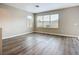 Bright living room featuring modern flooring and large windows, providing ample natural light at 12508 Evington Point Dr, Riverview, FL 33579