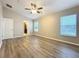 Spacious main bedroom with wood-look floors, ceiling fan, and abundant natural light at 12508 Evington Point Dr, Riverview, FL 33579