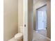 Compact powder room featuring a toilet, neutral paint, and tile flooring at 12508 Evington Point Dr, Riverview, FL 33579