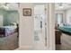 Bathroom view located between two bedrooms with white walls and access to a bathtub shower at 12523 Riverglen Dr, Riverview, FL 33569