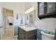 Bright bathroom showcasing a vanity with ample storage, a modern sink, and stylish fixtures at 12523 Riverglen Dr, Riverview, FL 33569