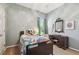 Cozy bedroom featuring comfortable furnishings, a single bed, and a built-in vanity at 12523 Riverglen Dr, Riverview, FL 33569