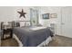 Comfortable bedroom featuring a full-sized bed, nautical themed decorative pillows, and a soft neutral color scheme at 12523 Riverglen Dr, Riverview, FL 33569