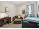 Cozy bedroom features a comfortable lounge chair, desk, and nicely decorated single bed at 12523 Riverglen Dr, Riverview, FL 33569